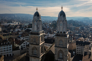 Zurich, Switzerland: Aerial view of the bell towers of the medieval Grossmunster cathedral in Zurich old town - obrazy, fototapety, plakaty