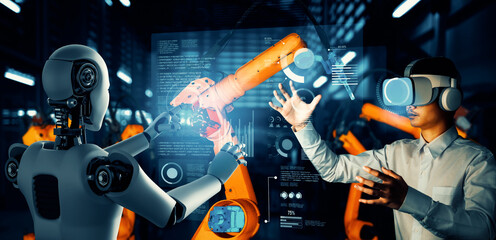 XAI Mechanized industry robot and human worker working together in future factory. Concept of...