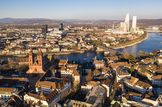 Basel, Switzerland: Aerial view of Basel old town, the cathedral and office tower along the Rhine river in late afternoon in  Switzerland thrid largest city.