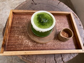 Matcha mousse cake serving in bamboo for Japanese dessert 