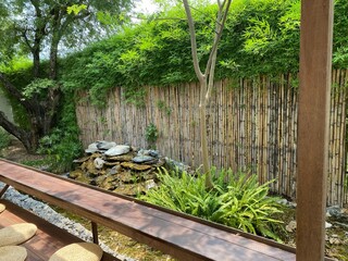 Japanese out door garden decorating by bamboo , tree ,wooden furniture 