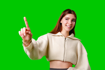 Young Woman in White Hoodie Gesturing Upwards on Green Screen Background