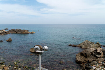 View of the lamp at the rocky seaside