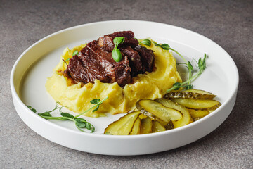 delicious stewed beef cheeks on mashed potatoes