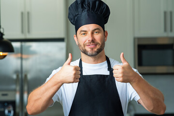 Happy chef cook with thumb up. Portrait of chef man in a chef cap in the kitchen. Man wearing apron and chefs uniform and chefs hat. Character kitchener, chef for advertising. - 786885529