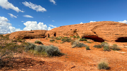 Bright desert red rock vista under a vivid blue sky.