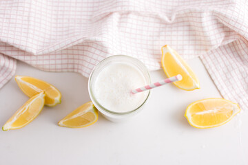 Refreshing creamy lemon drink in glass