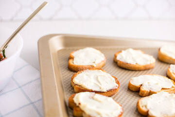 Toasted crostini topped with cream cheese mixture