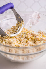 Mixing pastry dough with a pastry blender