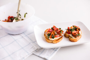Cheese tomato basil bruschetta on plate