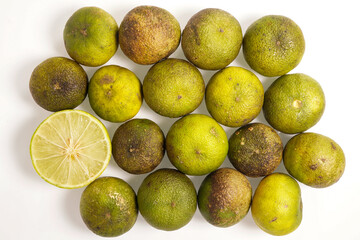 Organic lime fruits with discolored and uneven colours  due to no insecticides and chemicals used in growing