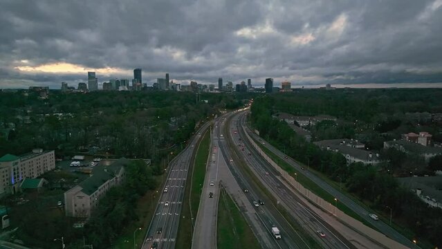 Aerial View Of Vehicles Driving Through T. Harvey Mathis Parkway To Downtown Buckhead At Night In Georgia, USA. 