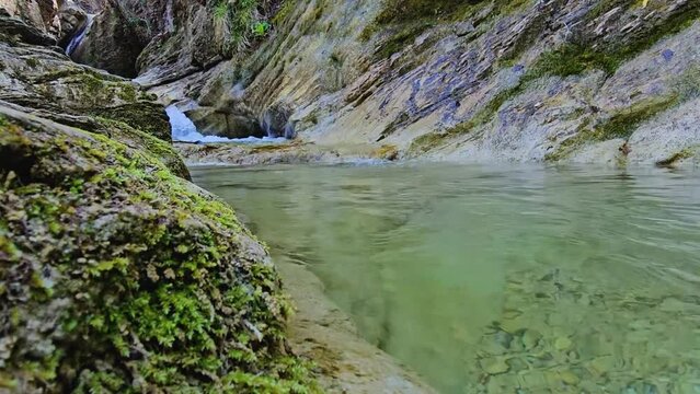 This footage captures the essence of natural tranquility, inviting viewers to immerse themselves in the peaceful ambiance of the forest. We are at "Sarnano" Italy through the forgotten waterfalls path