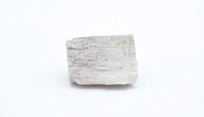 Cut out gypsum satin spar mineral rock isolated on white background. Gypsum is a soft sulfate...