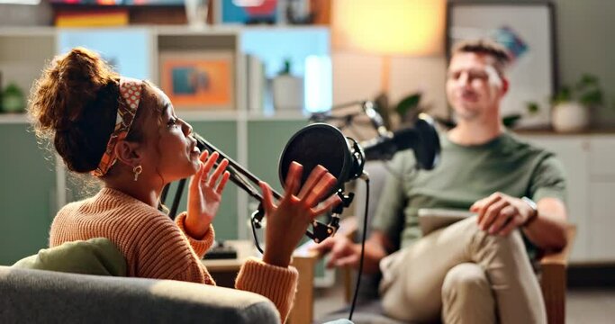 Happy people interview and laughing with podcast in meeting for discussion, conversation or news at studio. Young man and woman on air or talk show with mic for communication, live chat or recording