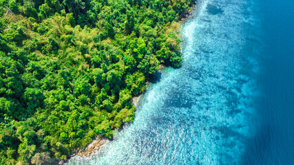 Aerial view of islands, Andaman Sea, natural blue waters and forests, tropical sea of Thailand. Beautiful scenery of the island with beautiful nature.	