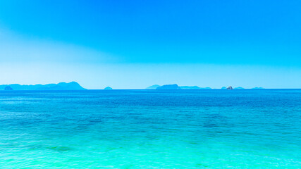 Ocean sea background and the clear sky For summer vacation ideas Nature of summer sea water with sunlight The sea sparkles against the blue sky