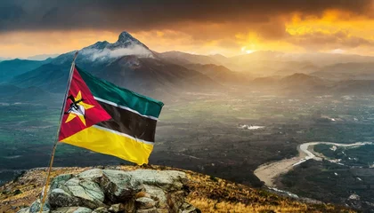 Poster Im Rahmen The Flag of Mozambique On The Mountain. © Daniel
