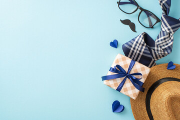 Stylish Father's Day gifts displayed on a blue background, including a hat, checkered gift box,...