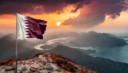 Ingelijste posters The Flag of Qatar On The Mountain. © Daniel