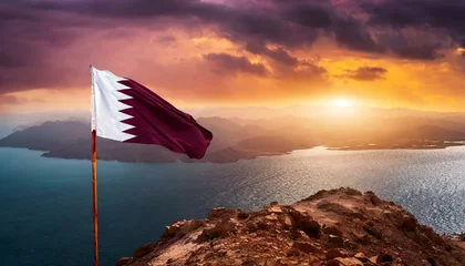 Fotobehang The Flag of Qatar On The Mountain. © Daniel