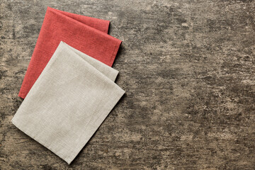 top view with gray kitchen napkin isolated on table background. Folded cloth for mockup with copy space, Flat lay. Minimal style