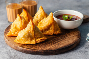 selective focus Samosa, Spiced potato-filled pastry, crispy, Savory, popular Indian snack serve...