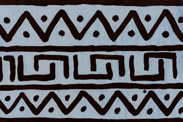 African drawing on a white wall with ornaments, closeup - 786946525