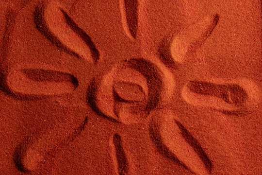 Small bright orange crystals of potassium dichromate, closeup, abstract colorful background