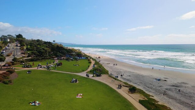 People Relaxing At Powerhouse Park In Del Mar, San Diego, California, United States. Aerial Descending Shot
