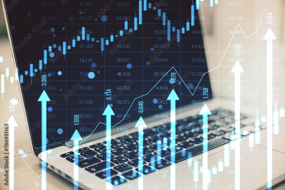 Poster close up of laptop at desk with growing blue vertical arrows and candlestick forex chart on blurry i