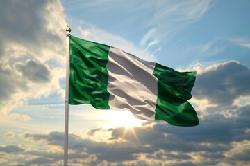 Vibrant 3D depiction of Nigerian flag flying against a blue sky.