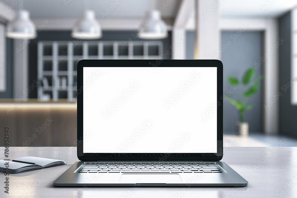 Poster Close up of modern designer desktop with empty white mock up laptop screen and blurry office with bookshelves in the background. 3D Rendering.