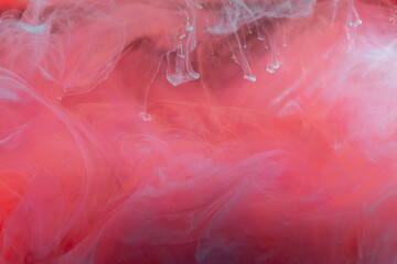 clouds of red and blue smoke on black background, clouds of paint in water, aquarium, abstract...