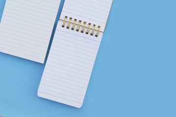 To do list note book on blue background.