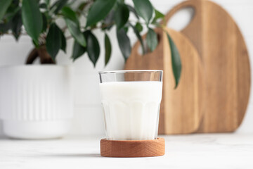 glass of milk in a bright kitchen, dairy products, calcium