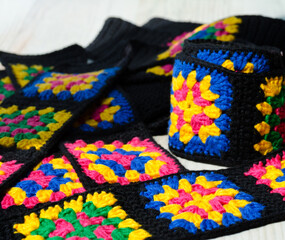 Colorful cotton granny square. Crochet texture close up photo.