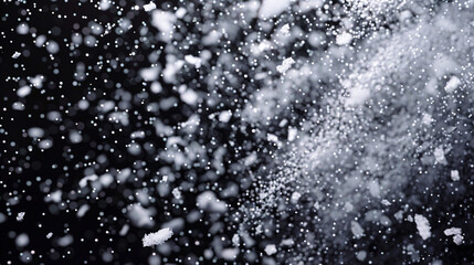 Snowstorm simulation with icy particles against dark.