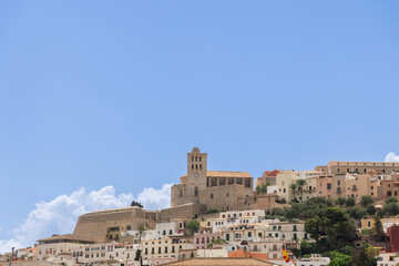 Fototapeta na wymiar Overlooking old Eivissa town, the Almudaina Castle in Ibiza, Spain, presents a picturesque view, seamlessly blending ancient history with the island scenic beauty