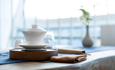 Chinese teacup on the table - obrazy, fototapety, plakaty