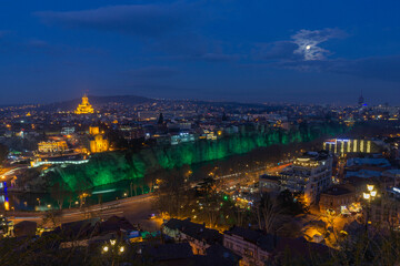 Night view of Avlabari district of Tbilisi, Georgia from Narikala fortress. Metekhi Church and...