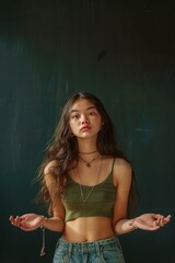 Obraz premium A woman with long hair wearing a green crop top