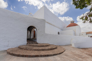 The architectural beauty of Puig de Missa church in Santa Eulalia, Ibiza, is highlighted by its...