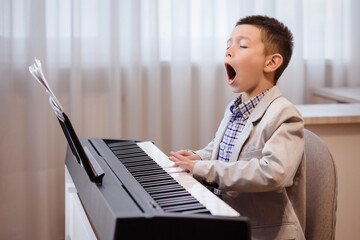 Piano Playing Piano Lessons Music Education Concept. Little Pianist Player Singing Song. 