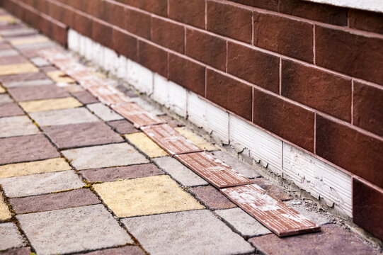 Defective Foundation Sheathing with Tiles. Foundation Problem. Poor Quality Bad Construction  Work.