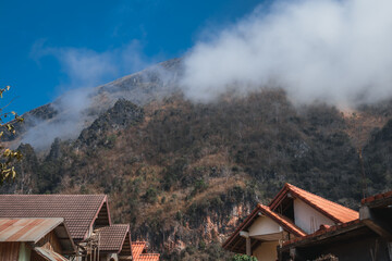Houses at the base of a mountain in laos