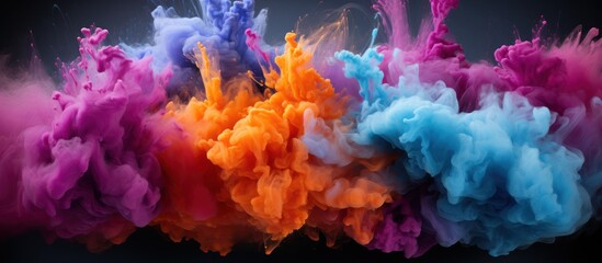 Fototapeta na wymiar Colorful powder explosion. abstract dust in the background