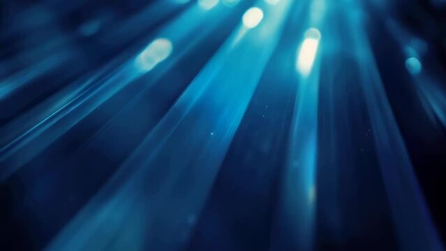 A blurred image showcasing a vibrant blue light source. Ideal for design projects or digital art concepts.