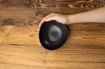 Bowl in Hands, Empty Bowl in Arms on Wooden Background, Vintage Kitchen Tableware Mockup