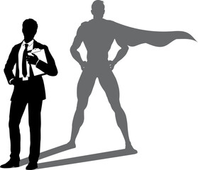 A superhero business man revealed by his shadow silhouette as a super hero in a cape